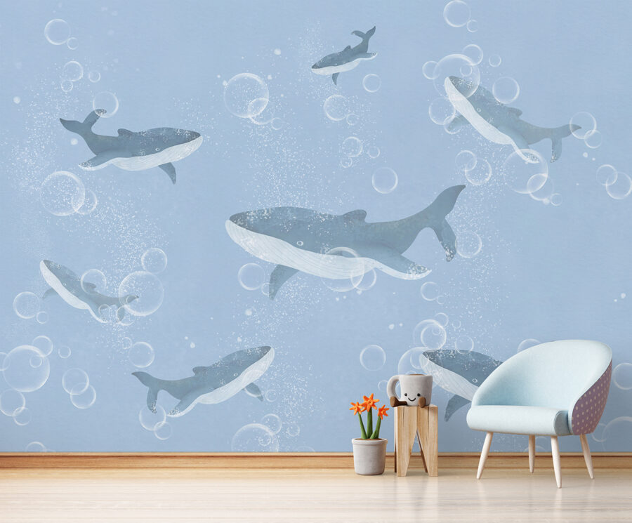 Un groupe de baleines nageant dans l'eau Un groupe de baleines nageant dans l'eau