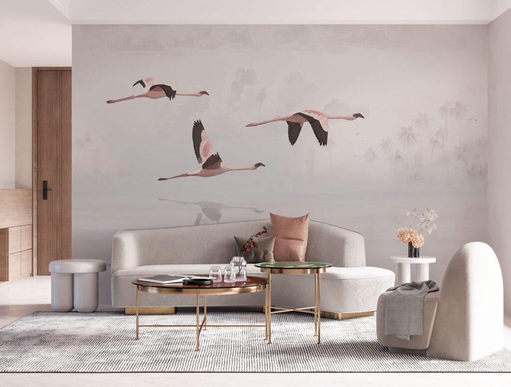 A group of flamingos flying over water