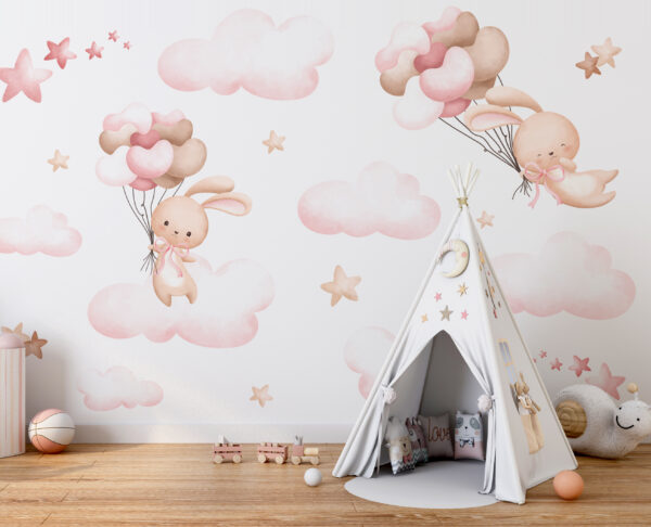 Groupe de nuages roses et lapin tenant des ballons Groupe de nuages roses et lapin tenant des ballons