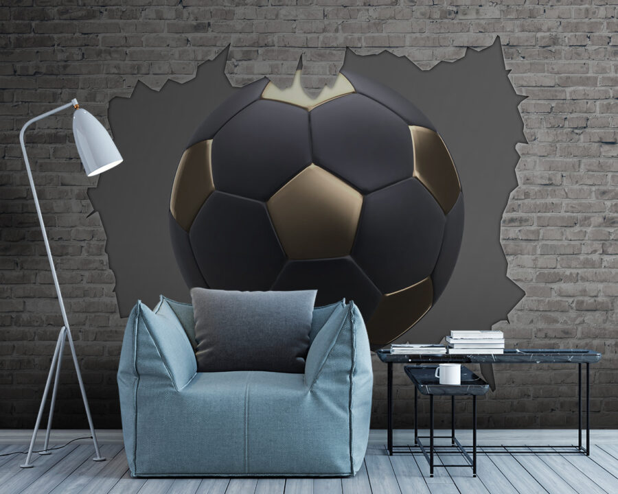 Ballon de football noir et or dans un trou dans un mur de briques