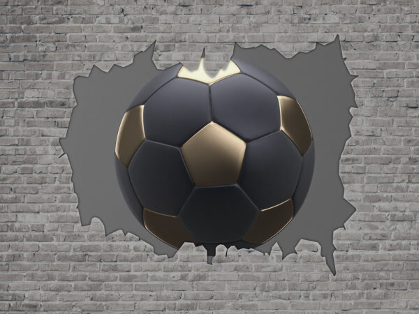 Un ballon de football traverse un mur Un ballon de football traverse un mur