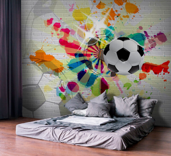 Ballon de football sur un mur de briques Ballon de football sur un mur de briques