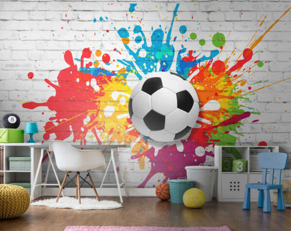 Ballon de football sur un mur de briques Ballon de football sur un mur de briques