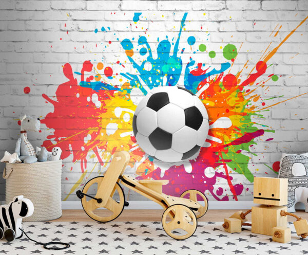 Ballon de football sur un mur de briques Ballon de football sur un mur de briques
