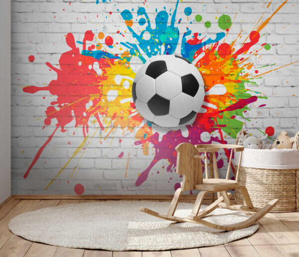 Ballon de football sur un mur de briques Ballon de football sur un mur de briques