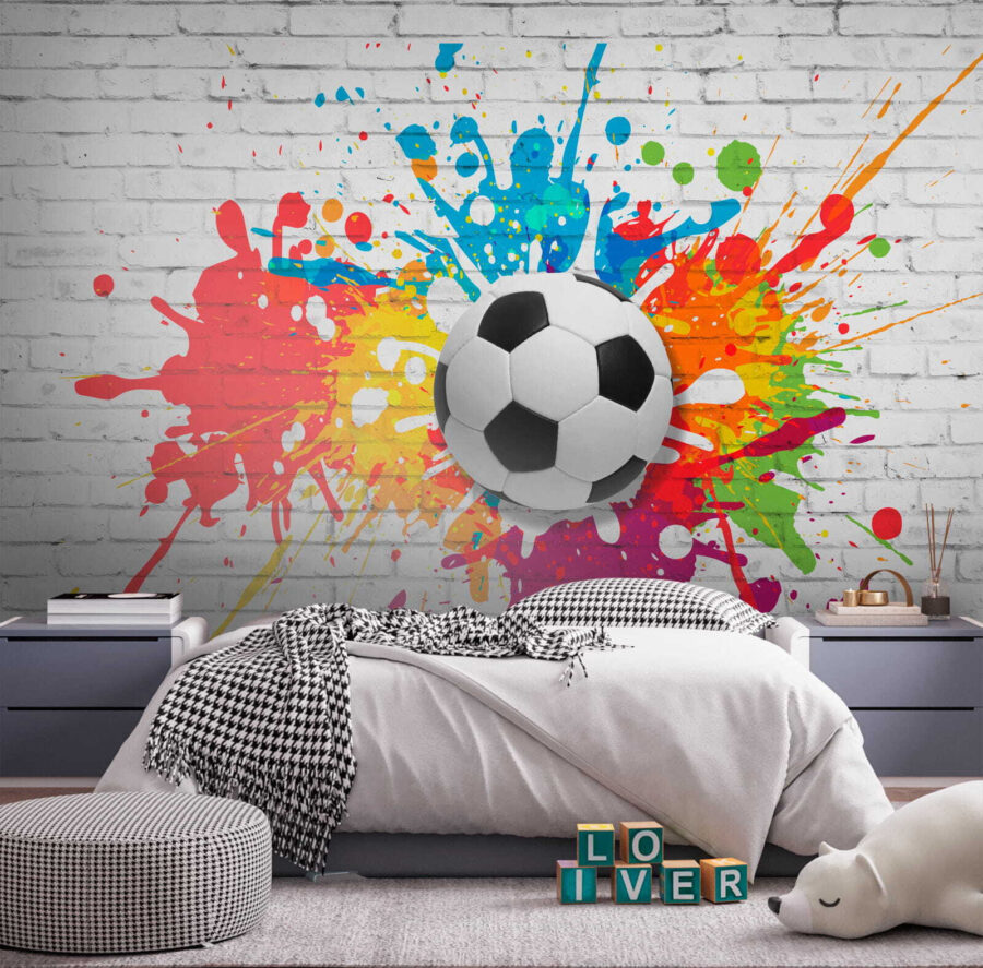 Ballon de football sur un mur de briques