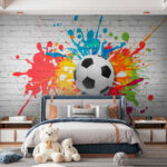 Papier peint Ballon de football sur un mur de briques