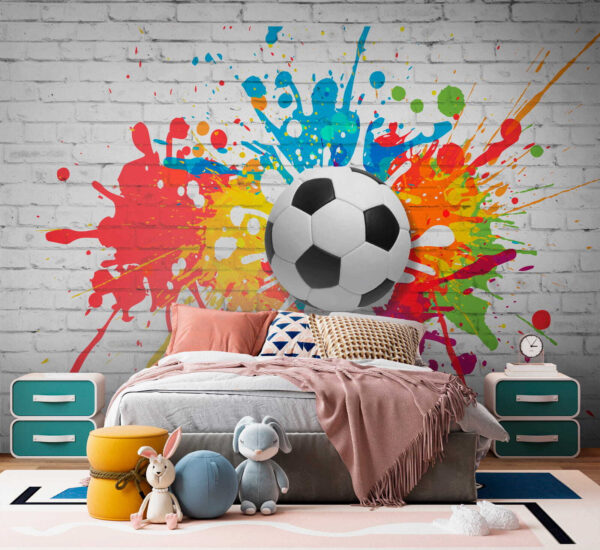 Ballon de football sur un mur de briques Ballon de football sur un mur de briques