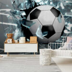 Papier peint Ballon de football traversant une vitre