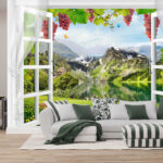 Papier peint Fenêtre avec vue sur un lac et des montagnes