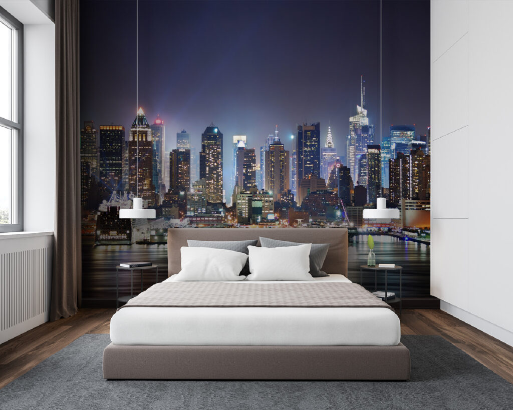 City skyline at night with lights reflecting on water City skyline at night with lights reflecting on water