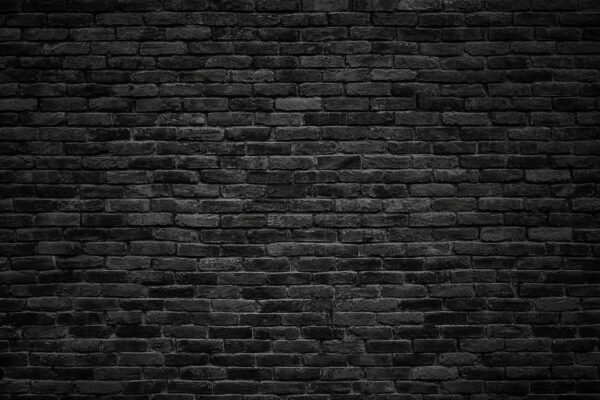 Mur de briques noires avec un point blanc Mur de briques noires avec un point blanc