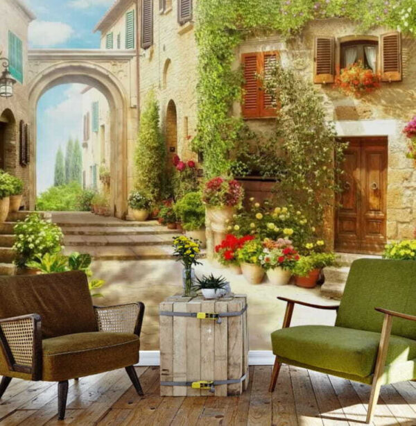 Bâtiment en pierre avec une porte et un portail avec des plantes en pots Bâtiment en pierre avec une porte et un portail avec des plantes en pots