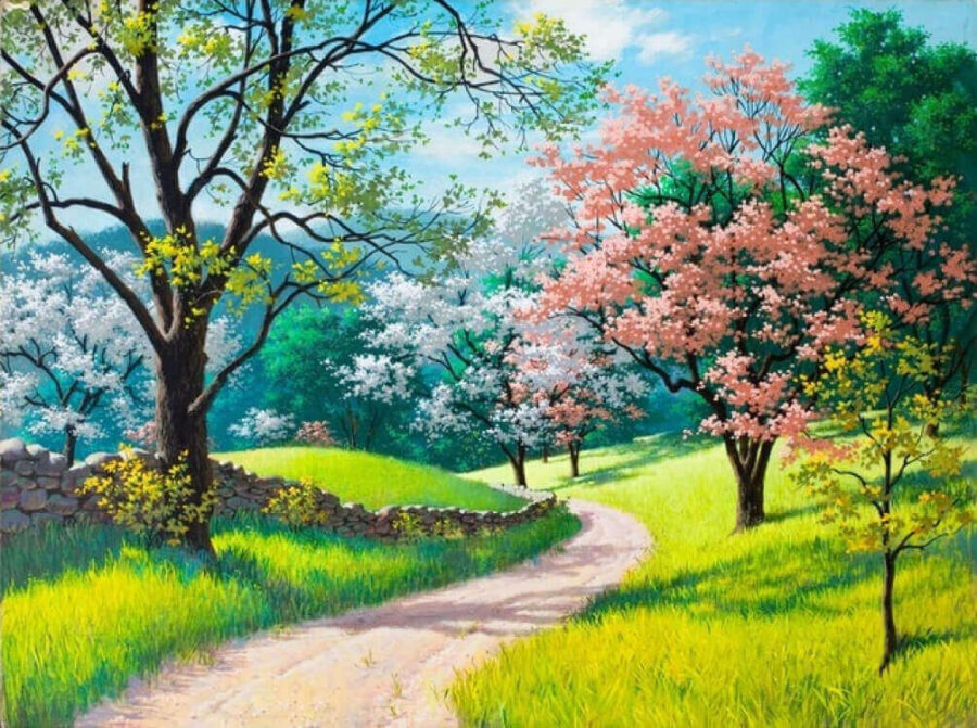 Chemin de terre traversant un champ herbeux avec des arbres