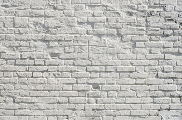 Mur de briques blanches avec des taches noires Mur de briques blanches avec des taches noires