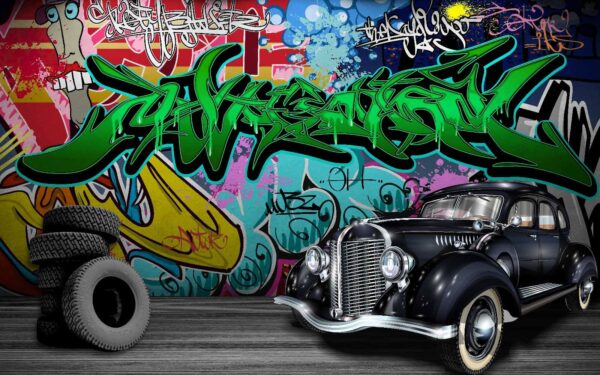 Voiture noire avec roues devant un mur coloré Voiture noire avec roues devant un mur coloré