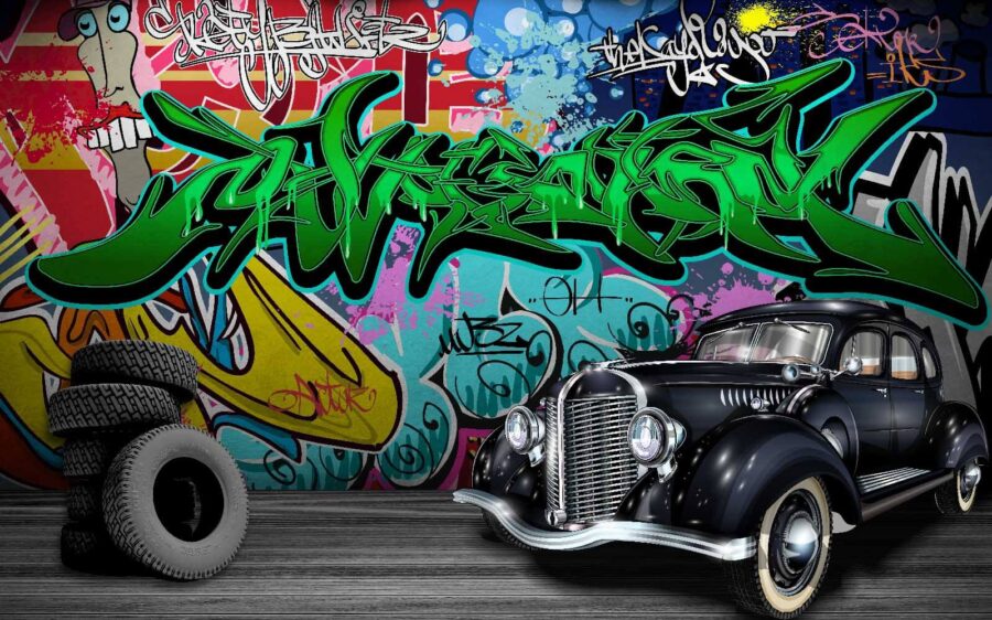 Voiture noire avec roues devant un mur coloré Voiture noire avec roues devant un mur coloré