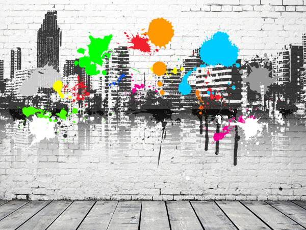 Mur de briques blanches avec des éclaboussures de peinture colorée Mur de briques blanches avec des éclaboussures de peinture colorée