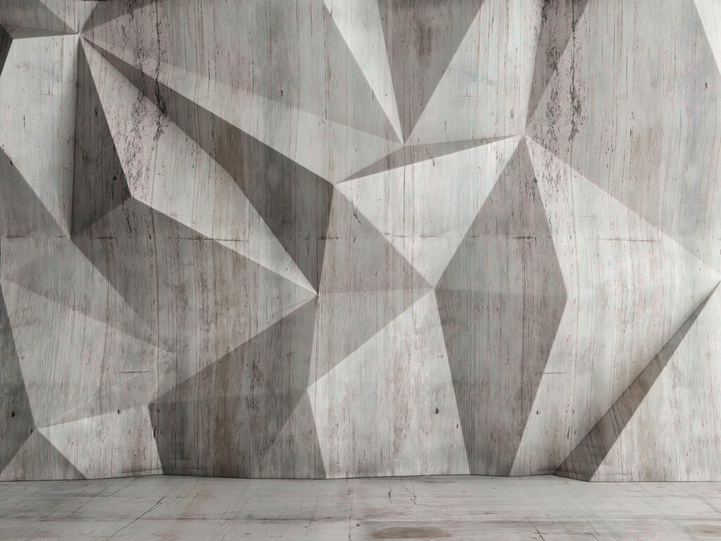 Un mur en béton avec un motif triangulaire Un mur en béton avec un motif triangulaire