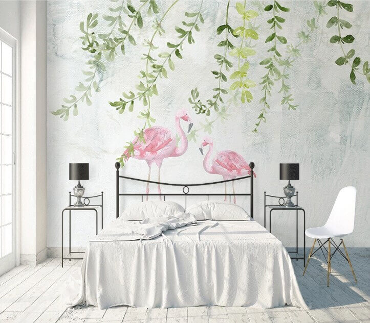 Deux flamants roses avec des feuilles vertes Deux flamants roses avec des feuilles vertes
