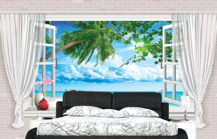 Fenêtre avec vue sur la plage et les oiseaux