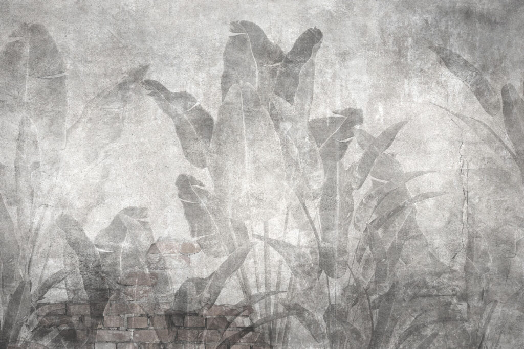 Grey wall with leaves and a brick wall Grey wall with leaves and a brick wall