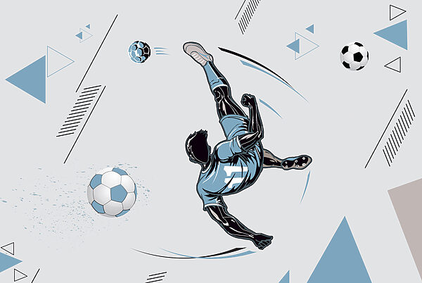Un joueur de football bottant un ballon Un joueur de football bottant un ballon