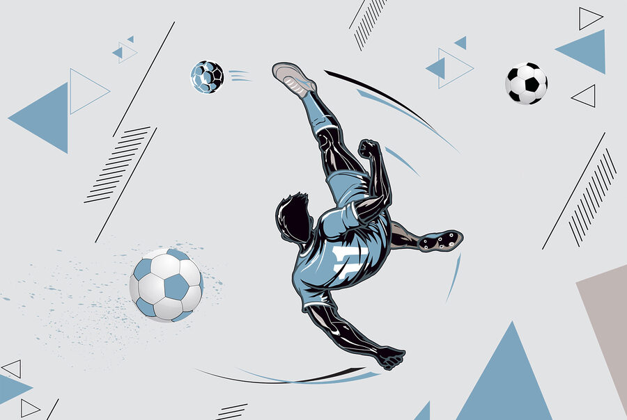 Un joueur de football bottant un ballon
