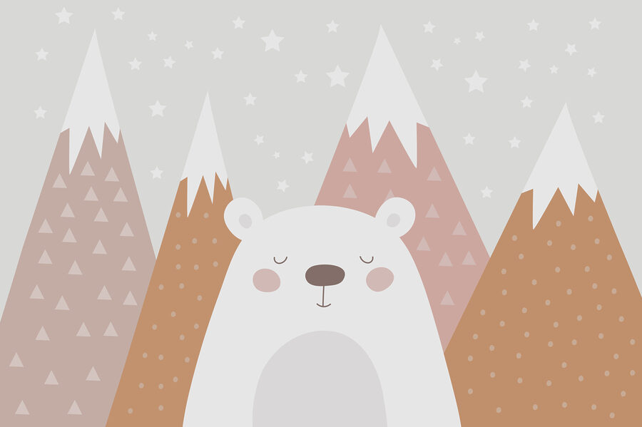 Un ours devant des montagnes