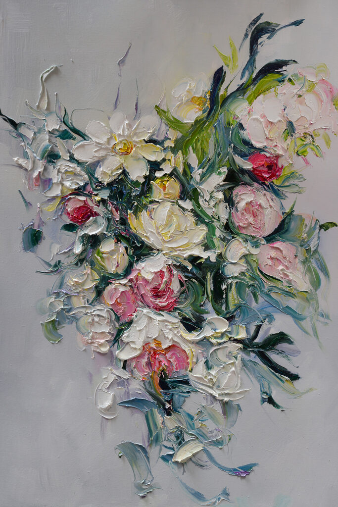 A painting of flowers on a white surface