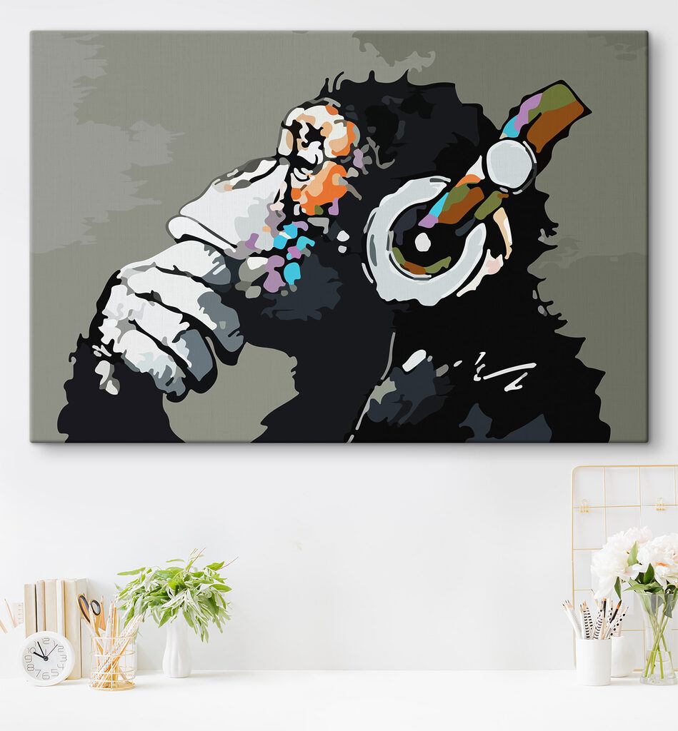 A cartoon of a monkey holding a headphone