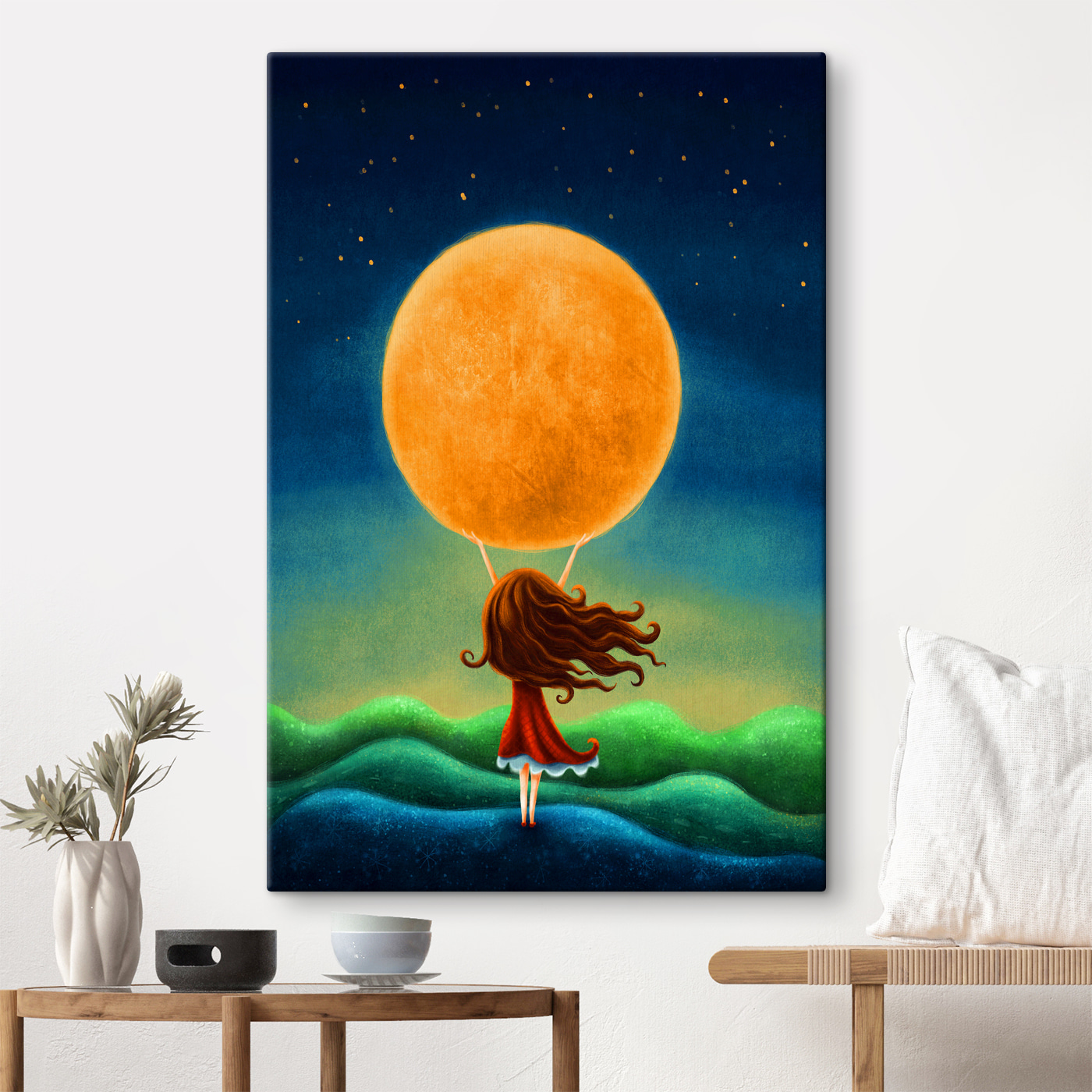 A girl holding a large yellow moon A girl holding a large yellow moon