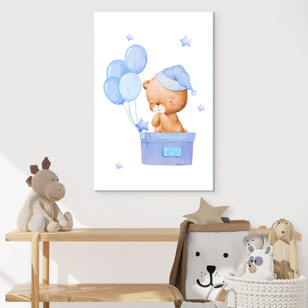 A teddy bear in a box with balloons A teddy bear in a box with balloons