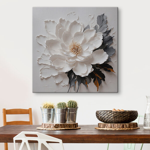 Une fleur blanche avec des feuilles noires et grises Une fleur blanche avec des feuilles noires et grises