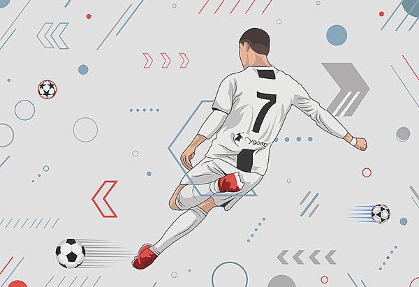 Un joueur de football bottant un ballon Un joueur de football bottant un ballon