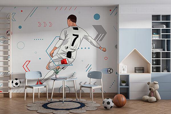 Un joueur de football bottant un ballon Un joueur de football bottant un ballon