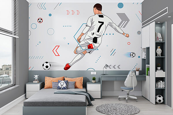 Un joueur de football bottant un ballon Un joueur de football bottant un ballon