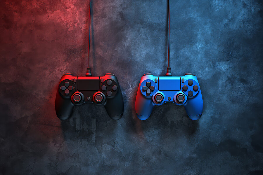 Une manette de jeu vidéo bleue et rouge Une manette de jeu vidéo bleue et rouge