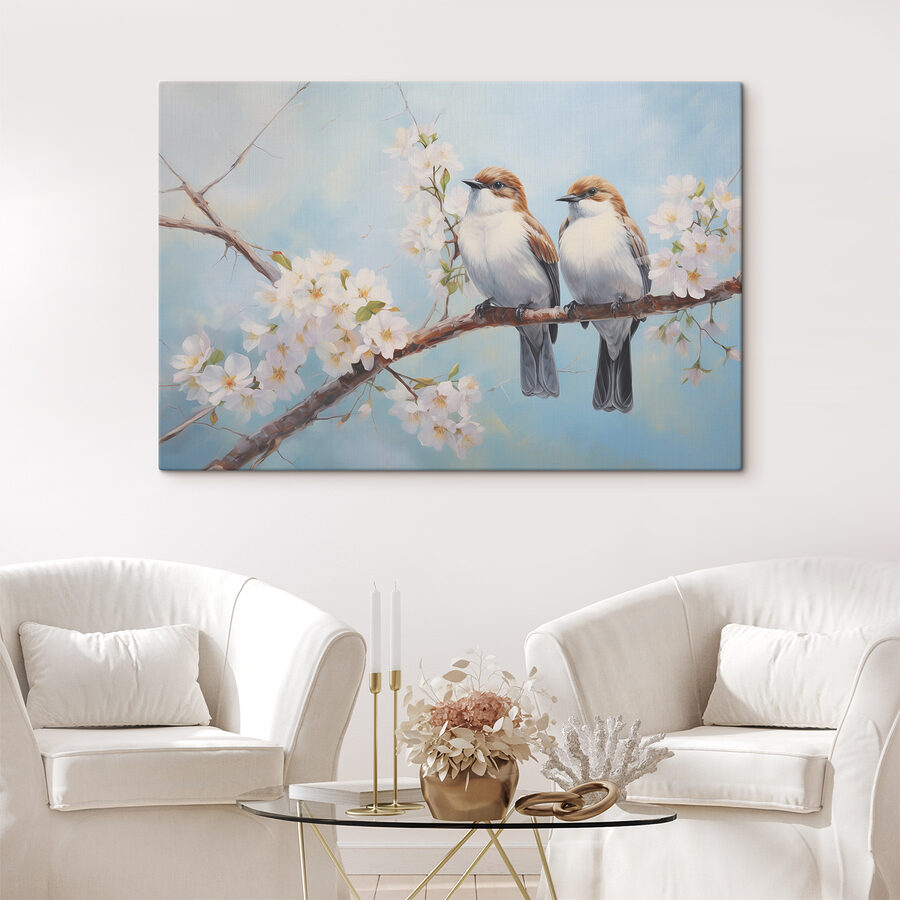 Deux oiseaux sur une branche avec des fleurs blanches
