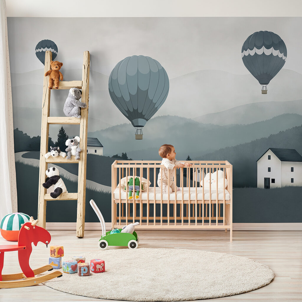 Group of hot air balloons flying over a village Group of hot air balloons flying over a village