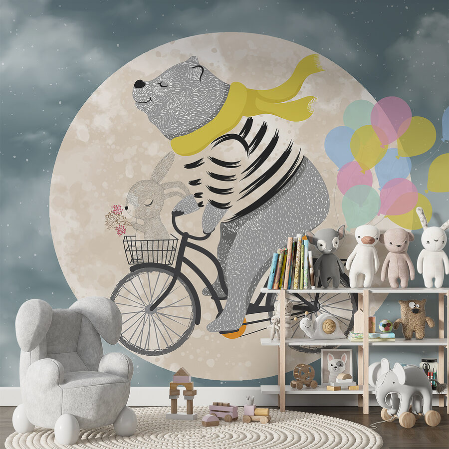 Ours faisant du vélo avec des ballons