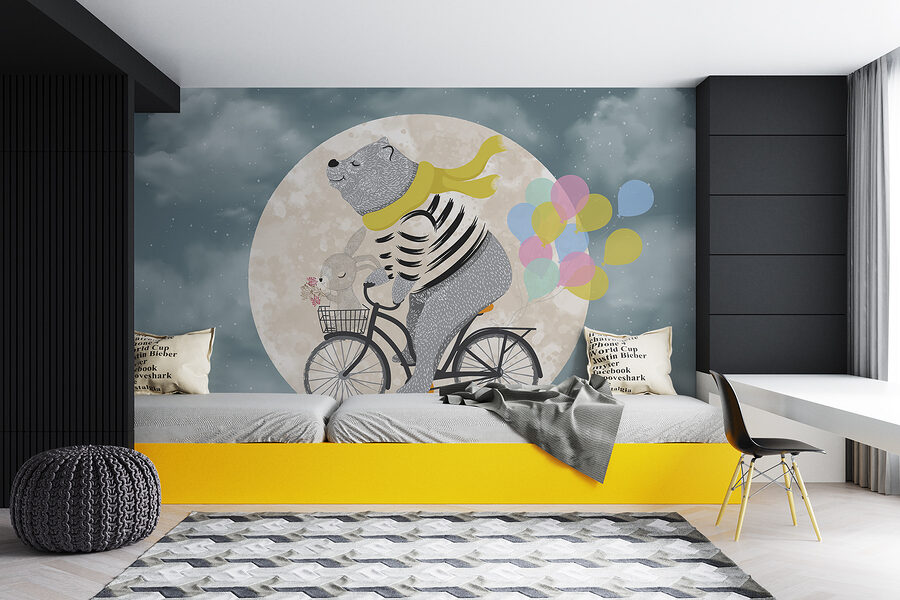 Ours faisant du vélo avec des ballons