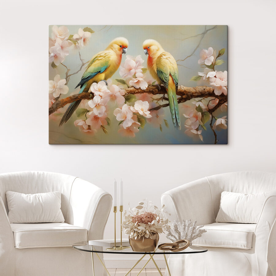 Deux oiseaux sur une branche avec des fleurs