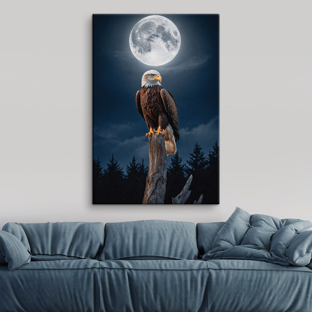 Bald eagle on a post with a full moon in the background