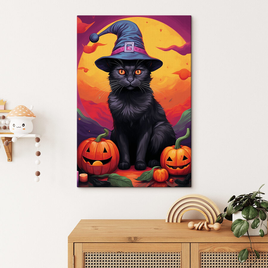 Chat noir portant un chapeau et des citrouilles
