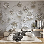 Papier peint Fleurs en papier blanc sur une surface blanche