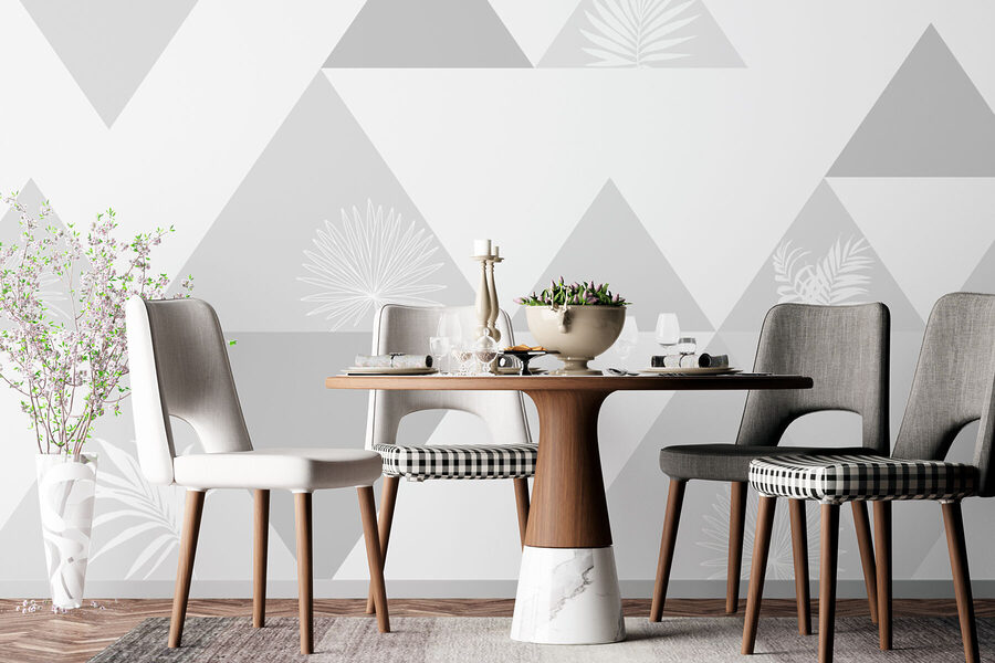 Triangles blancs et gris avec un motif de feuilles