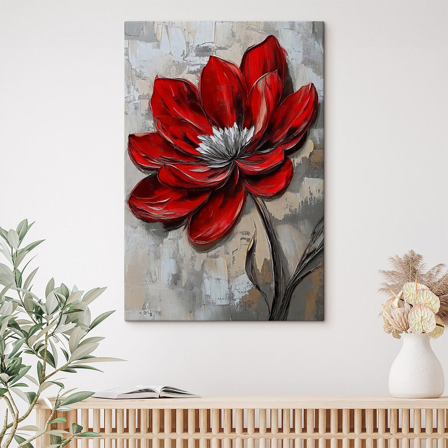 Fleur rouge sur une surface grise