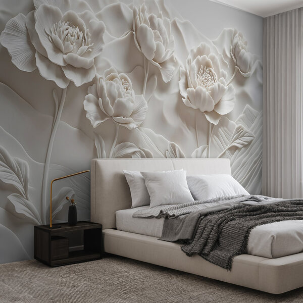 Sculpture de fleurs blanches sur un mur Sculpture de fleurs blanches sur un mur