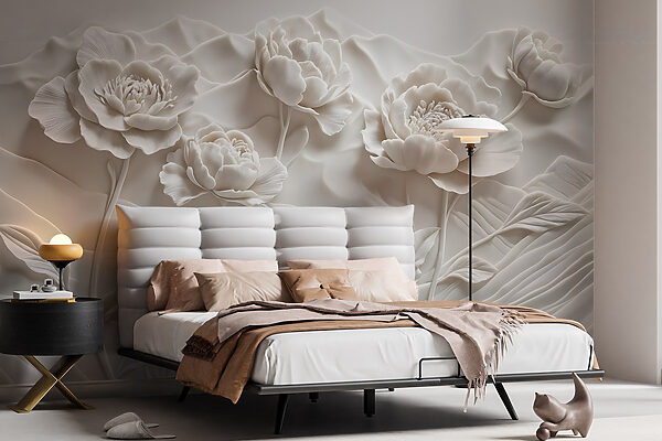 Sculpture de fleurs blanches sur un mur Sculpture de fleurs blanches sur un mur
